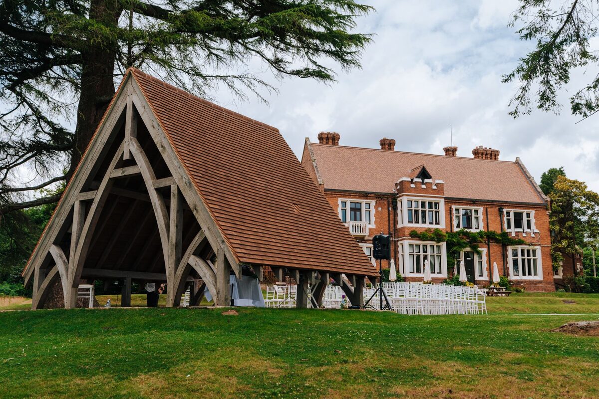 The oak-framed outdoor ceremony space in front of Highley Manor in Sussex